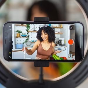 beautiful-african-american-woman-food-blogger-vlogger-recording-video-smartphone_1210255-1636